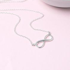 Sterling silver infinity necklace.  This necklace is a perfect way to symbolise unbreakable bonds of love and friendship. The polished infinity is set on a simple sterling silver trace chain which is available in 3 lengths. It comes beautifully presented in a foil printed gift box tied with ribbon. THE DETAILS: * Sterling silver infinity - 22mm * Sterling silver trace chain * Handmade in the UK * Beautifully gift boxed