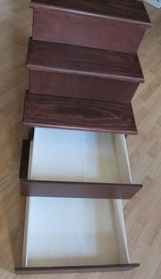 a wooden shelf sitting on top of a hard wood floor