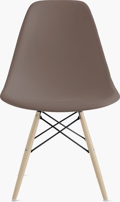 a brown plastic chair with wooden legs