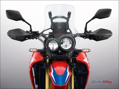 the front view of a red motorcycle with clear windshields and headlamps on