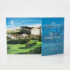 an open brochure showing the front and back cover of a hotel at the beach