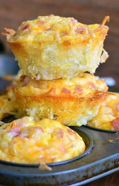 three muffins stacked on top of each other in a baking pan with cheese and ham