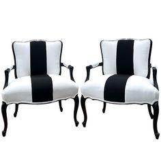 two black and white striped chairs sitting next to each other