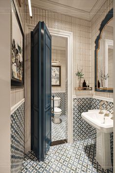 an open door leading into a bathroom with blue and white tiles