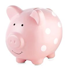 a pink piggy bank with white polka dots