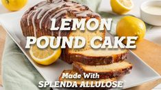 lemon pound cake with splenda alllose on a white plate next to sliced lemons