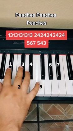 a person is playing the piano with numbers and symbols on each key, which are highlighted in red