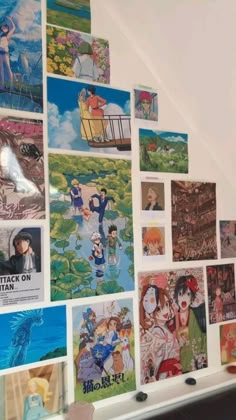 there are many anime pictures on the wall