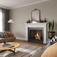 a living room filled with furniture and a fire place in the middle of the room