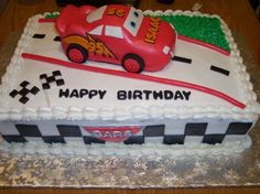 a birthday cake that is shaped like a race car