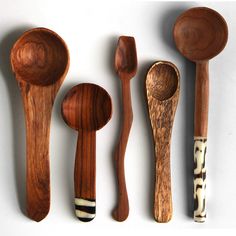 five wooden spoons and two wood utensils