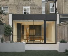 an outside view of a house with glass doors