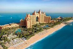 an aerial view of the palace hotel and beach in abu, united arab - emirates