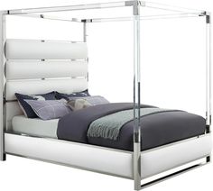 a white bed with a metal frame and headboard on it's side, in front of a white background