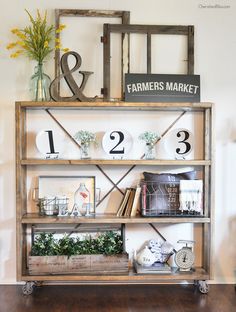 an old book shelf is decorated with flowers and other items for sale on pinterest