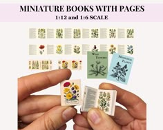 miniature books with pages 1 - 12 and 16 - scale are being held by two hands