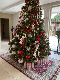 a christmas tree decorated with candy canes and ornaments