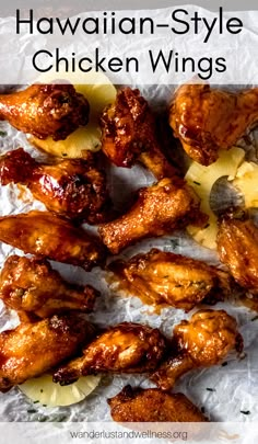 hawaiian style chicken wings with pineapple slices on top and the words hawaiian style chicken wings above it