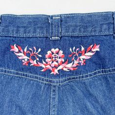 Vintage 1970s high waisted jeans featuring; a zip fly with single snap at the waist a high waisted cut with belt loops at the waist pockets at the hips straight leg a garland of flowers is embroidered in the center on the back just under the waistband white top stitching Of a mid weight, 100% cotton denim in a medium blue wash, the embroidery is done in pink and white. With no labels or tags, measurements when laid out flat are; 11 1/2 inches at the waist 17 inches at the hip 12 inch rise 28 3/4 inch inseam In good, preworn, vintage condition with no holes or funky odors, it has a spot of something gray low on one leg...this may soak out ...if not these would make great cut offs! We are happy to ship internationally and combine shipping. Retro Embroidered Bottoms For Spring, Retro Spring Jeans With Belt Loops, Vintage Embroidered Straight Leg Bottoms, High Rise Embroidered Denim Blue Jeans, 60s Jeans, Embroidered Retro Cotton Jeans, Retro Embroidered Denim Bottoms, 70s Embroidery Jeans, Vintage Embroidered Denim Bottoms