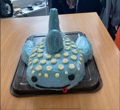 a cake shaped like a submarine with cookies on it