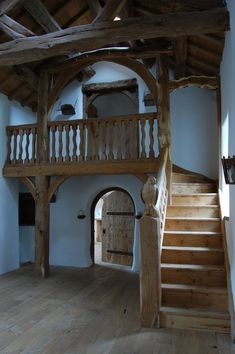 the inside of an old building with wooden stairs