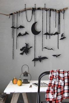 a room with a table and some bats hanging on the wall