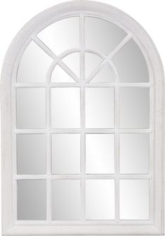 an arched window with white paint on it