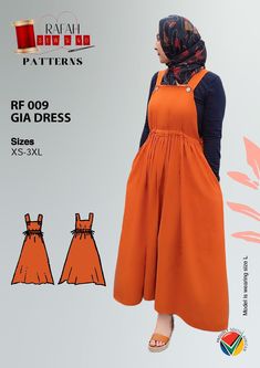 a woman wearing an orange dress and head scarf, with her hands on her hips