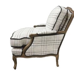 an old fashioned chaise lounge chair with black and white plaid upholster