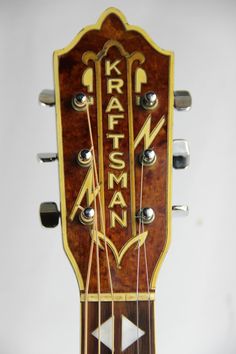 an acoustic guitar with the name kartasan on it's back and sides