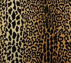 an animal print fabric with black spots on it's sides and brown spots on the back