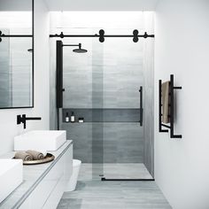 a white bathroom with two sinks and mirrors