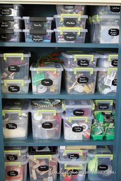 an organized shelf filled with plastic containers and bins