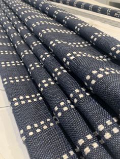 some blue and white checkered cloths on a conveyor belt in a factory