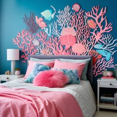 a bedroom decorated in pink and blue with corals on the wall