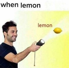 a man holding a lemon in front of a sign that says, when u see a lemon i see a lemon