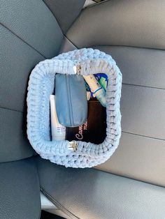 the inside of a car seat with items in it