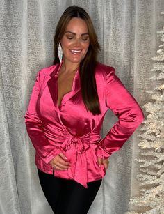 Get ready to make a statement this holiday season with our long sleeve pink silk wrap blazer top. This stylish yet versatile top is the perfect addition to your wardrobe, combining the classic sophistication of a blazer with the delicate femininity of silk fabric. The stunning pink color adds a pop of playful charm, making it the perfect choice for any festive occasion. Runs true to size! Chic Long Sleeve Party Blazer, Long Sleeve Satin Blazer For Party, Chic Long Sleeve Blazer For Parties, Chic Pink Evening Blazer, Chic Pink Blazer For Evening, Chic V-neck Blazer For Party, Glamorous Long Sleeve Blazer For Date Night, Chic Satin Party Blazer, Feminine Pink V-neck Outerwear