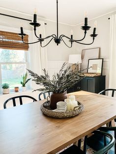 a dining room table with candles on it