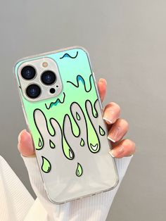 a person holding up a phone case with an image of a liquid droplet on it