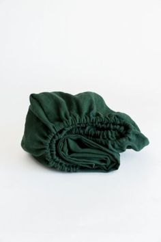 folded green cloth on white background