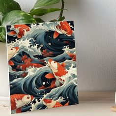 a painting of koi fish swimming in the ocean on a wave art board print