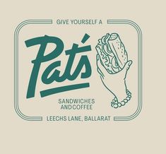 a hand holding a sandwich with the words pat's written in green on it