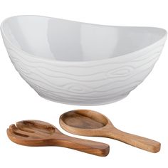 two wooden spoons and a white bowl on a white background