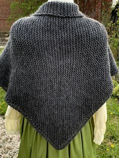 the back of a woman's shawl, with an open knitted collar