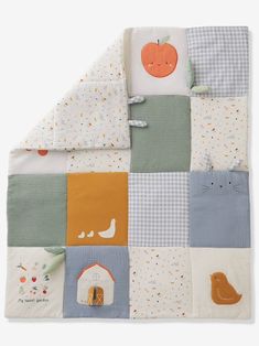 a baby blanket with patchwork and pumpkins on it