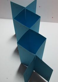 an open blue box sitting on top of a white table