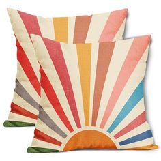 two pillows with colorful sunbursts on them