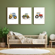 three pictures of tractors are hanging on the wall next to a baby's crib