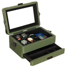 PRICES MAY VARY. CUSTOMIZE YOUR WATCH SETUP - The Military watch box is the most flexible watch storage option out there. The Military Watch Box houses 10 watches in its standard layout but can easily switch to a 4-slot setup with additional room for other essentials. Remove the inside walls to create space deep enough to store and protect larger items like sunglasses, a smartwatch, a phone, or a wallet. (Apple watch stand included!) MILITARY INSPIRED - Inspired by military footlockers, each det Accessory Drawer, Military Color, Watch Safes, Apple Watch Stand, Sunglasses Storage, Watch Stand, Green Watch, Small Watch, Valet Tray